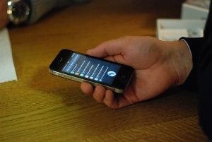 iPhone with Siri loaded on screen.